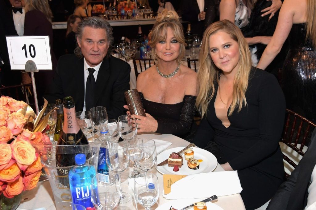 BEVERLY HILLS, CA - JANUARY 08:  Actors Kurt Russell (L), Goldie Hawn and Amy Schumer at the 74th annual Golden Globe Awards sponsored by FIJI Water at The Beverly Hilton Hotel on January 8, 2017 in Beverly Hills, California.  (Photo by Charley Gallay/Getty Images for FIJI Water)