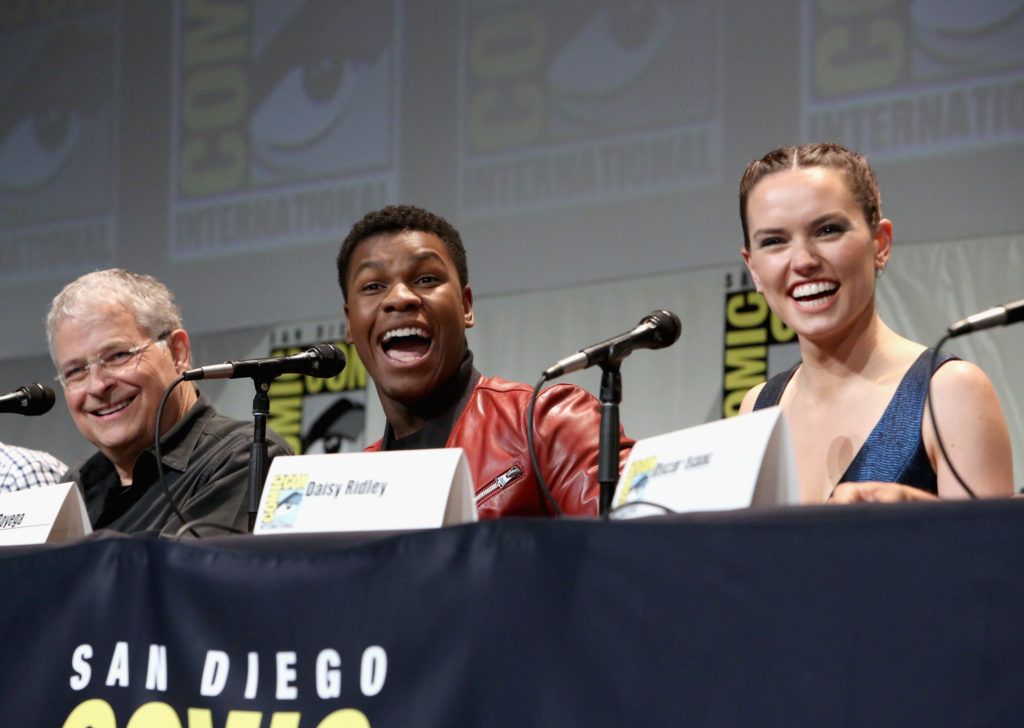 Screenwriter Lawrence Kasdan and actors John Boyega and Daisy Ridley at the Hall H Panel for "Star Wars: The Force Awakens" during Comic-Con International 2015 at the San Diego Convention Center on July 10, 2015 in San Diego, California.  (Photo by Jesse Grant/Getty Images for Disney)