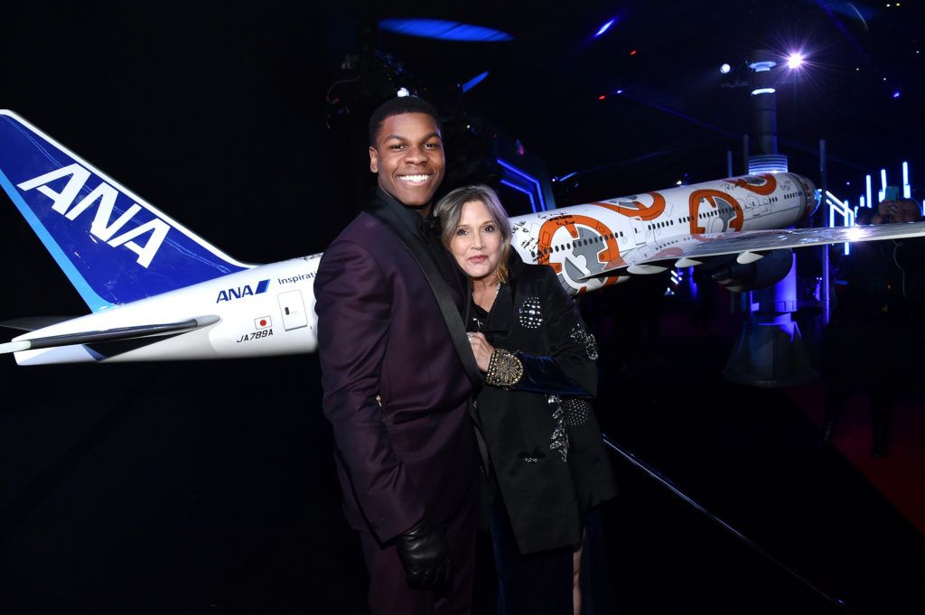 John Boyega (L) and Carrie Fisher attend the World Premiere of Star Wars: The Force Awakens at the Dolby, El Capitan, and TCL Theatres on December 14, 2015 in Hollywood, California.  (Photo by Mike Windle/Getty Images for Disney)