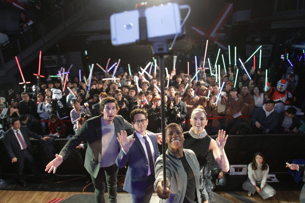 John Boyega (2nd R) takes selfie with actor Adam Driver (L) director J.J. Abrams (2nd L) and actress Daisy Ridley (R) during the event for fans ahead of 'Star Wars: The Force Awakens' South Korea premiere at the Octagon on December 9, 2015 in Seoul, South Korea.  (Photo by Chung Sung-Jun/Getty Images for Walt Disney Studios)