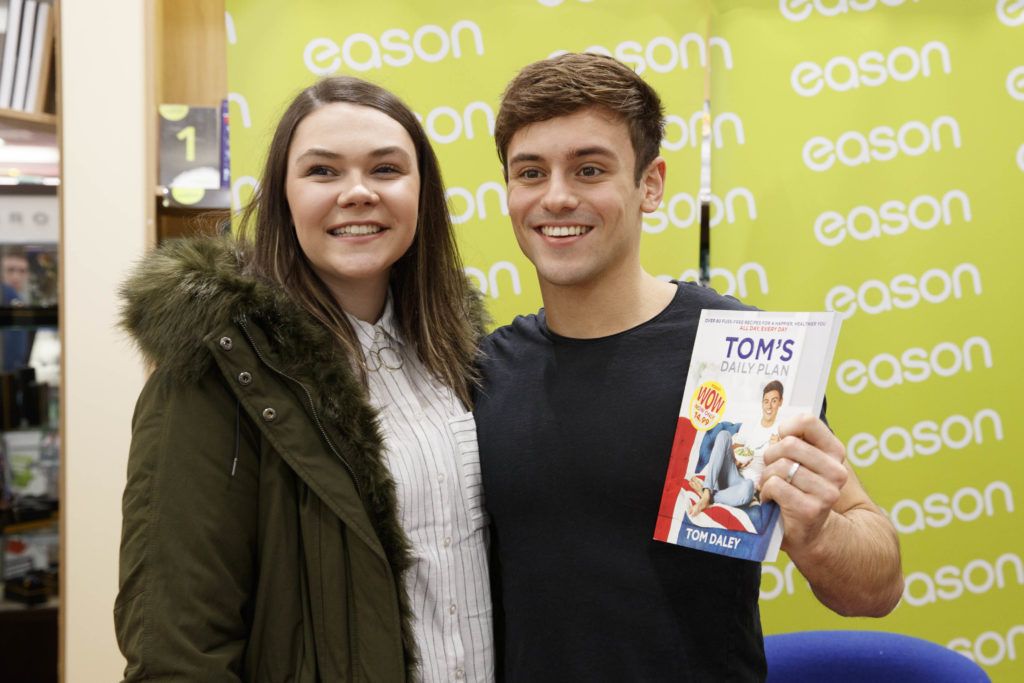 British Diving Olympian, Tom Daley, pictured with Olivia Bell from Belfast in Eason Dundrum Town Centre where he was signing copies of his new book, Tom’s Daily Plan. Picture Andres Poveda