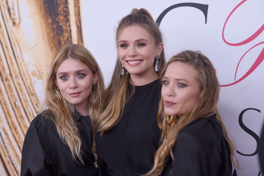 Elizabeth Olsen (center) and Mary-Kate and Ashley Olsen attend the 2016 CFDA Fashion Awards at the Hammerstein Ballroom on June 6, 2016 in New York City.  (Photo by Jamie McCarthy/Getty Images)