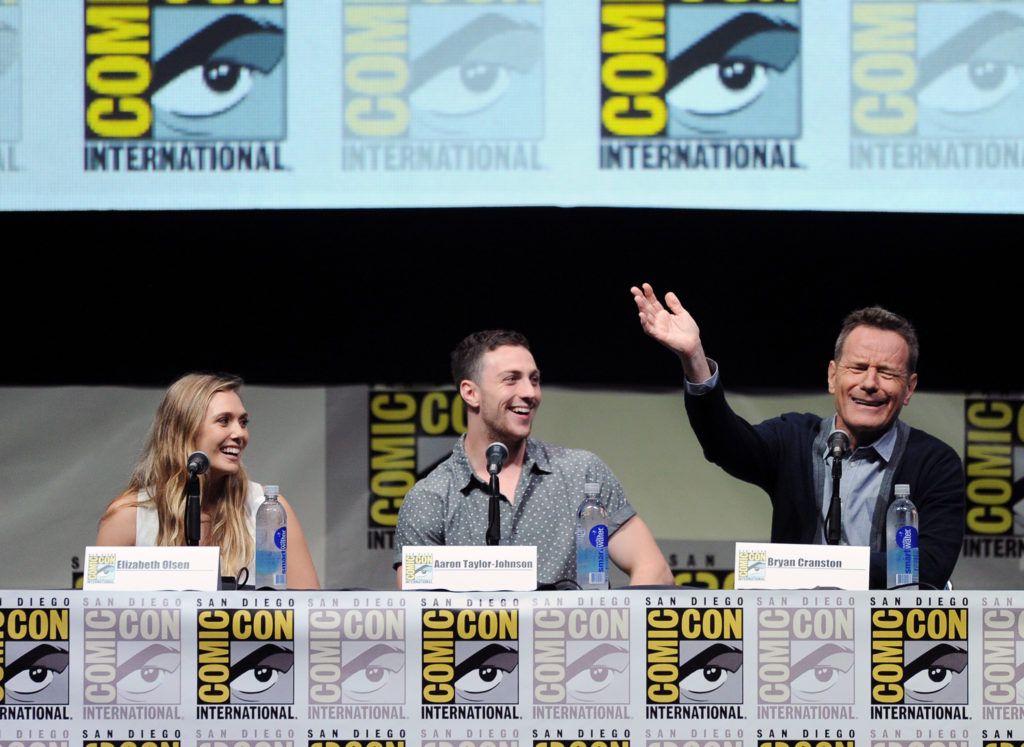 Elizabeth Olsen, Aaron Taylor-Johnson, and Bryan Cranston speak onstage at the Warner Bros. and Legendary Pictures preview of "Godzilla" during Comic-Con International 2013 at San Diego Convention Center on July 20, 2013 in San Diego, California.  (Photo by Kevin Winter/Getty Images)