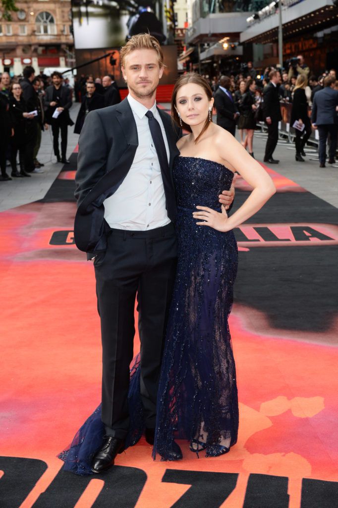 Elizabeth Olsen and Boyd Holbrook attend the European premiere of 'Godzilla' at the Odeon Leicester Square on May 11, 2014 in London, England.  (Photo by Dave J Hogan/Getty Images)