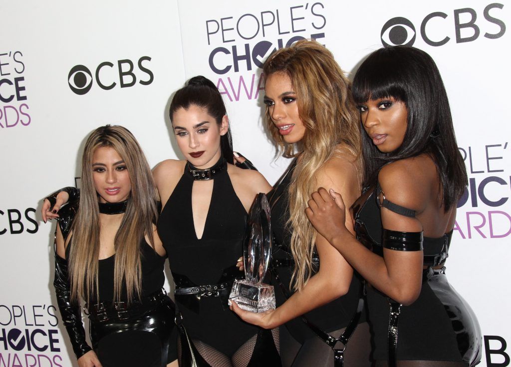 (L-R) Recording artists Ally Brooke, Dinah Jane Hansen, LLauren Jauregui and Normani Hamilton of Fifth Harmony pose in the press room at the People's Choice Awards 2017 at Microsoft Theatre in Los Angeles, California, on January 18, 2017.       (Photo TOMMASO BODDI/AFP/Getty Images)