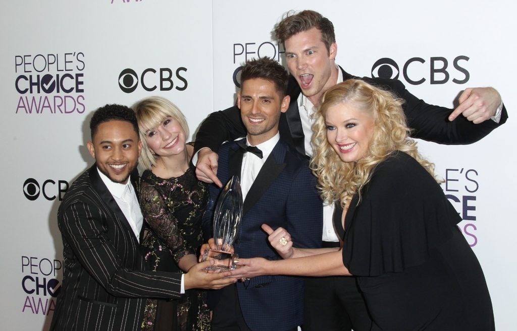 The cast of "Baby Daddy",  (L-R) actors Tahj Mowry, Chelsea Kane, Jean-Luc Bilodeau, Derek Theler and Melissa Peterman pose in the press room during the People's Choice Awards 2017 at Microsoft Theater in Los Angeles, California, on January 18, 2017.    (Photo TOMMASO BODDI/AFP/Getty Images)