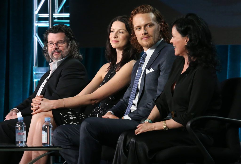 Executive Producer Ronald D. Moore, actors Caitrona Balfe and Sam Heughan and author Diana Gabaldon speak onstage during the Outlander panel on January 8, 2016 in Pasadena, California.  (Photo by Frederick M. Brown/Getty Images)