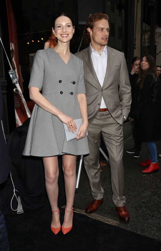 Caitriona Balfe and Sam Heughan attend "Outlander" and Saks Fifth Avenue Photocall at Saks Fifth Avenue on April 7, 2016 in New York City.  (Photo by Laura Cavanaugh/Getty Images)