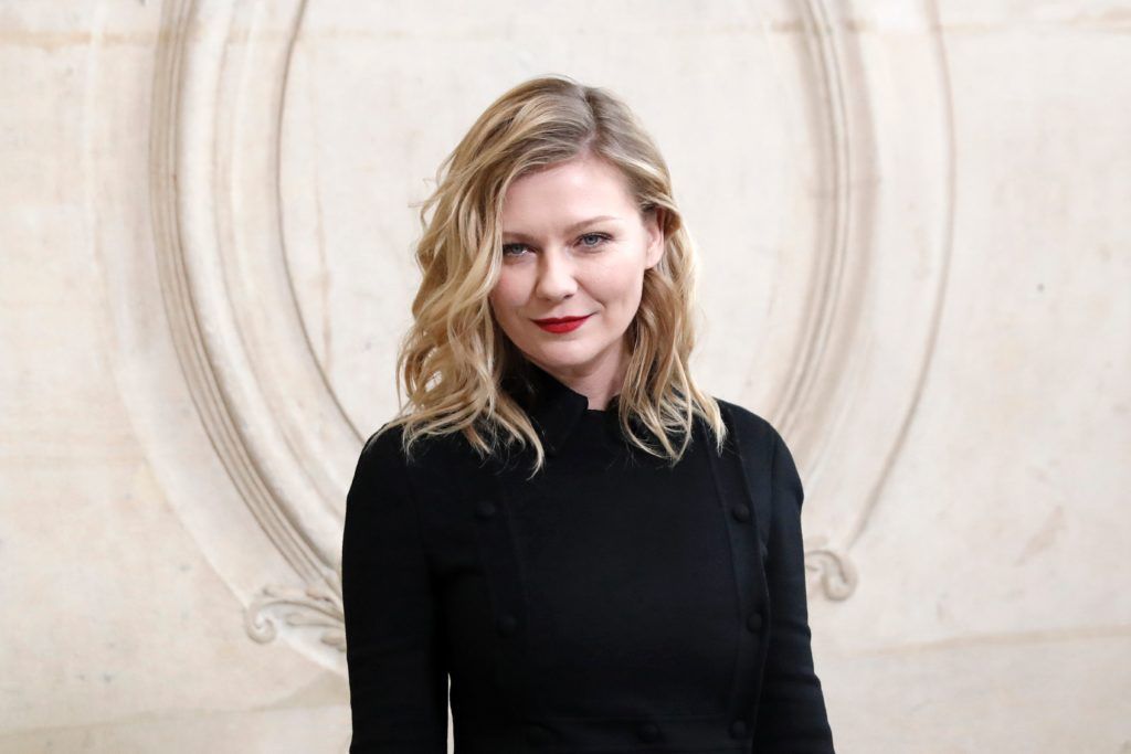Kirsten Dunst poses before the Christian Dior 2017 spring/summer Haute Couture collection on January 23, 2017 in Paris. (Photo PATRICK KOVARIK/AFP/Getty Images)