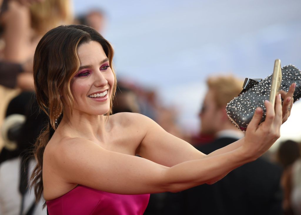 Sophia Bush takes a photo with fans as she arrives for the 23rd Annual Screen Actors Guild Awards at the Shrine Exposition Center on January 29, 2017, in Los Angeles, California. (Photo ROBYN BECK/AFP/Getty Images)