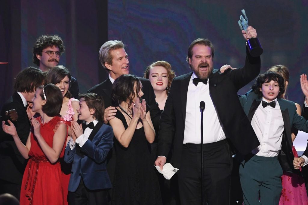 LOS ANGELES, CA - JANUARY 29:  (L-R) Actors Millie Bobby Brown, Natalia Dyer, John Paul Reynolds, Noah Schnapp, Winona Ryder, Matthew Modine, Shannon Purser, David Harbour, and Finn Wolfhard of 'Stranger Things' accept Outstanding Performance by an Ensemble in a Drama Series onstage during The 23rd Annual Screen Actors Guild Awards at The Shrine Auditorium on January 29, 2017 in Los Angeles, California. 26592_014  (Photo by Kevin Winter/Getty Images )