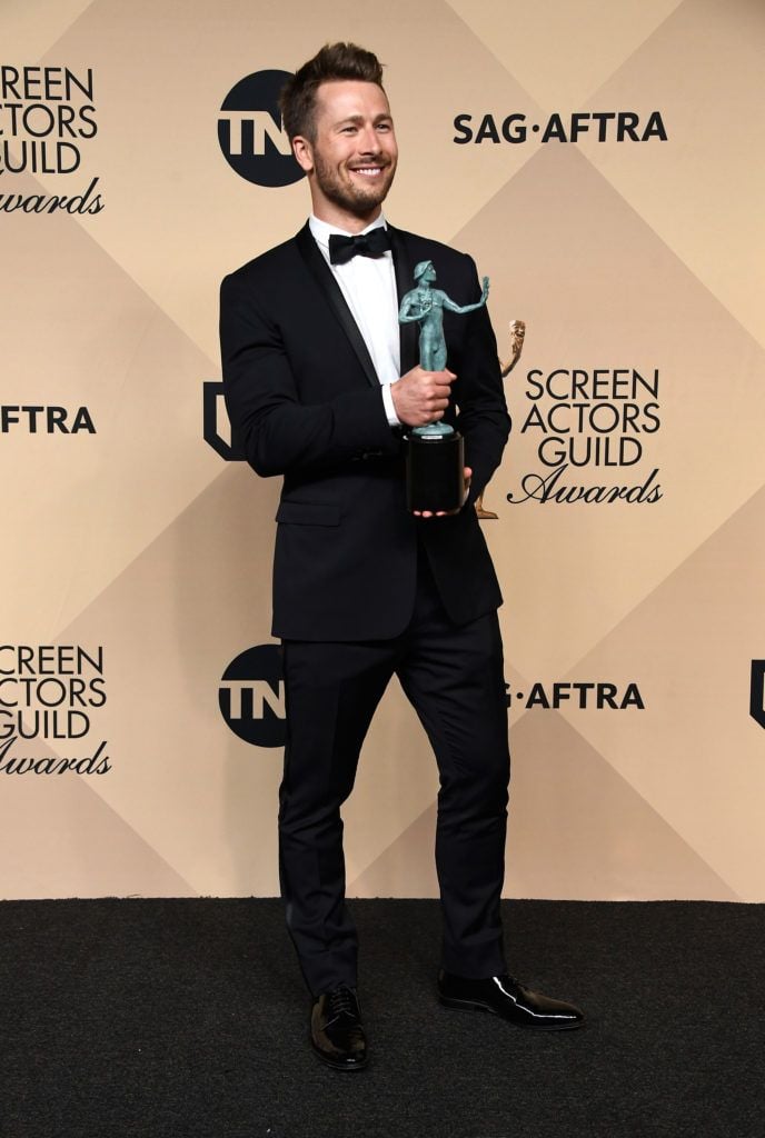 LOS ANGELES, CA - JANUARY 29:  Actor Glen Powell, co-recipient of the Outstanding Performance by a Cast in a Motion Picture award for 'Hidden Figures,' poses in the press room during The 23rd Annual Screen Actors Guild Awards at The Shrine Auditorium on January 29, 2017 in Los Angeles, California. 26592_008  (Photo by Frazer Harrison/Getty Images)