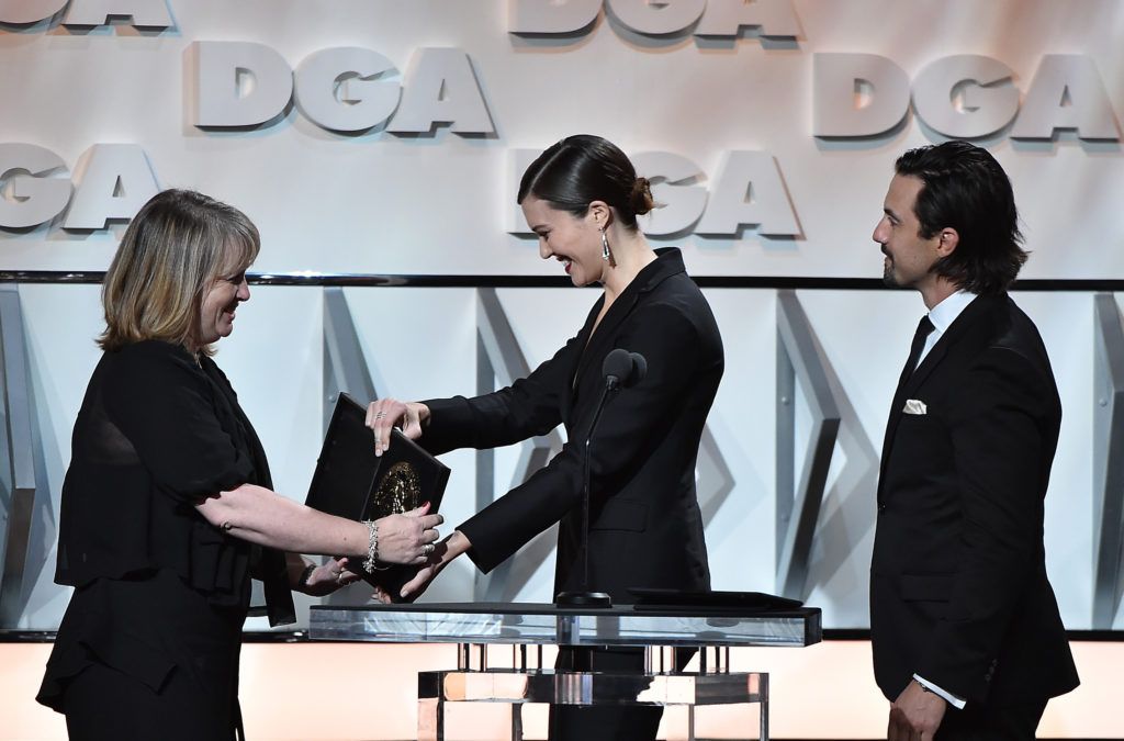 Director Becky Martin accepts the plaque for Outstanding Directorial Achievement in Comedy Series for the 'Veep' episode 'Inauguration' from actors Mandy Moore and Milo Ventimiglia, onstage during the 69th Annual Directors Guild of America Awards at The Beverly Hilton Hotel on February 4, 2017 in Beverly Hills, California.  (Photo by Alberto E. Rodriguez/Getty Images for DGA)