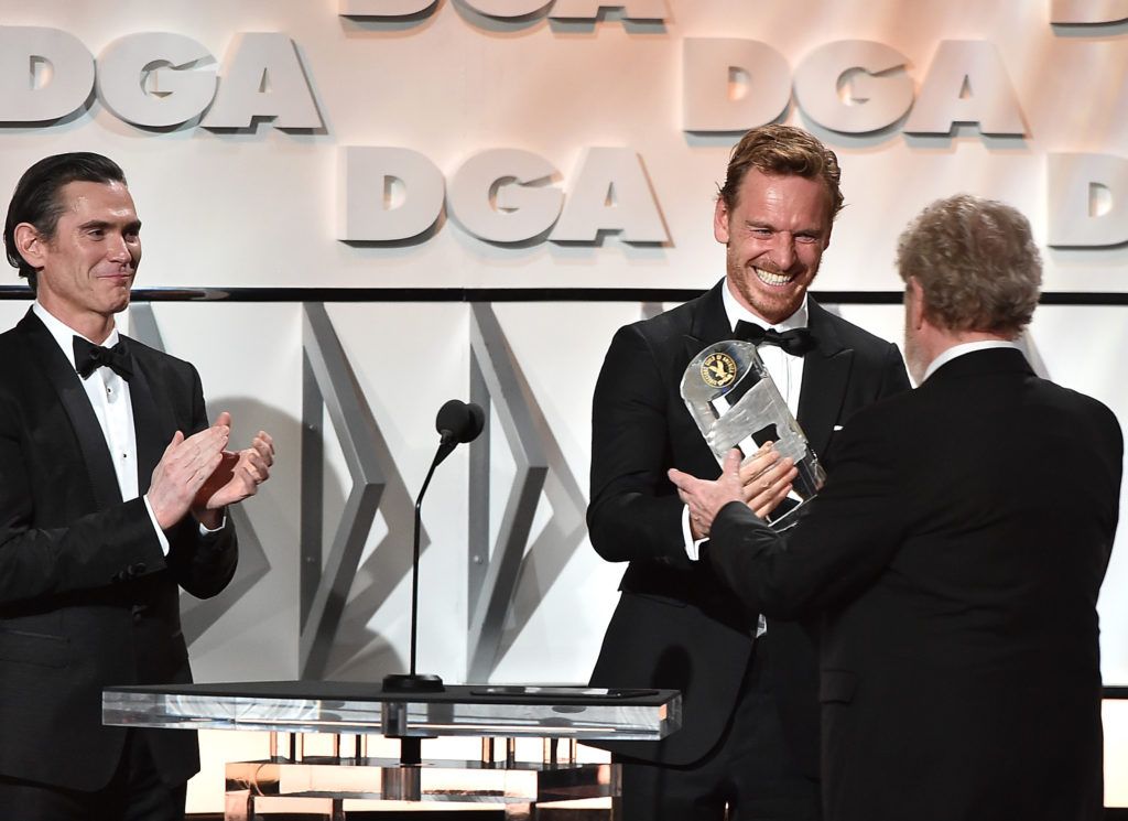 Billy Crudup and Michael Fassbender present the Lifetime Achievement in Feature Film Direction Award to Sir Ridley Scott onstage during the 69th Annual Directors Guild of America Awards at The Beverly Hilton Hotel on February 4, 2017 in Beverly Hills, California.  (Photo by Alberto E. Rodriguez/Getty Images for DGA)