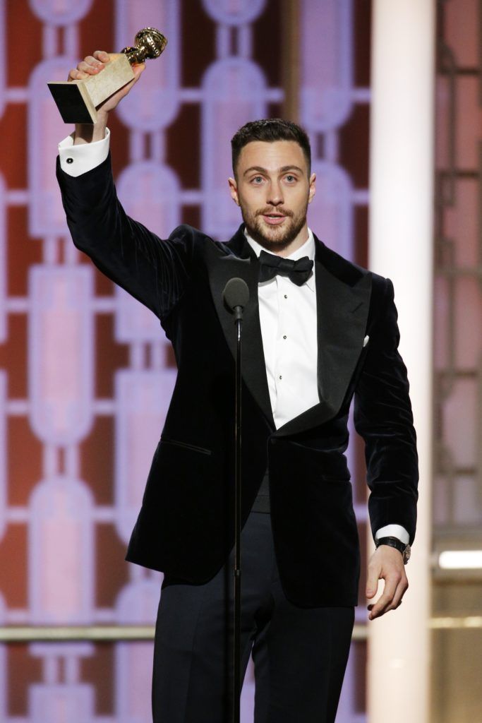In this handout photo provided by NBCUniversal, Aaron Taylor-Johnson accepts the award for Best Supporting Actor In A Motion Picture for his role in "Nocturnal Animals" during the 74th Annual Golden Globe Awards at The Beverly Hilton Hotel on January 8, 2017 in Beverly Hills, California. (Photo by Paul Drinkwater/NBCUniversal via Getty Images)