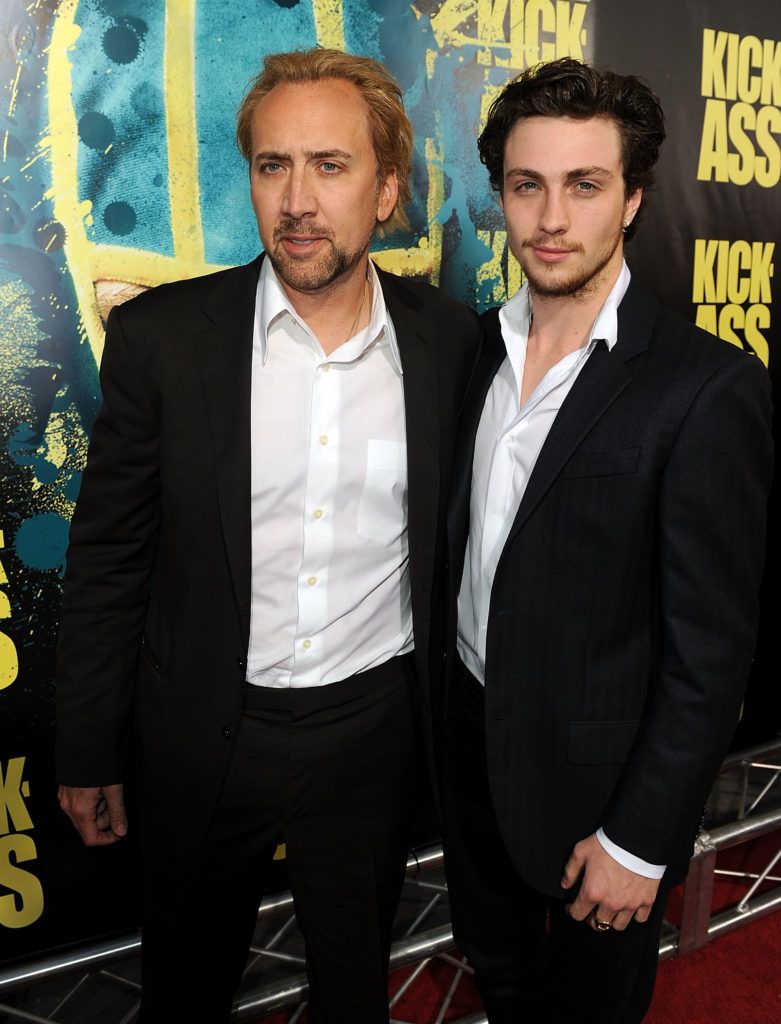 Actors Nicolas Cage (L) and Aaron Johnson arrive at the premiere of Lionsgate's "Kick-Ass" held at The Cinerama Dome at the Arclight Hollywood on April 13, 2010 in Los Angeles, California.  (Photo by Kevin Winter/Getty Images)