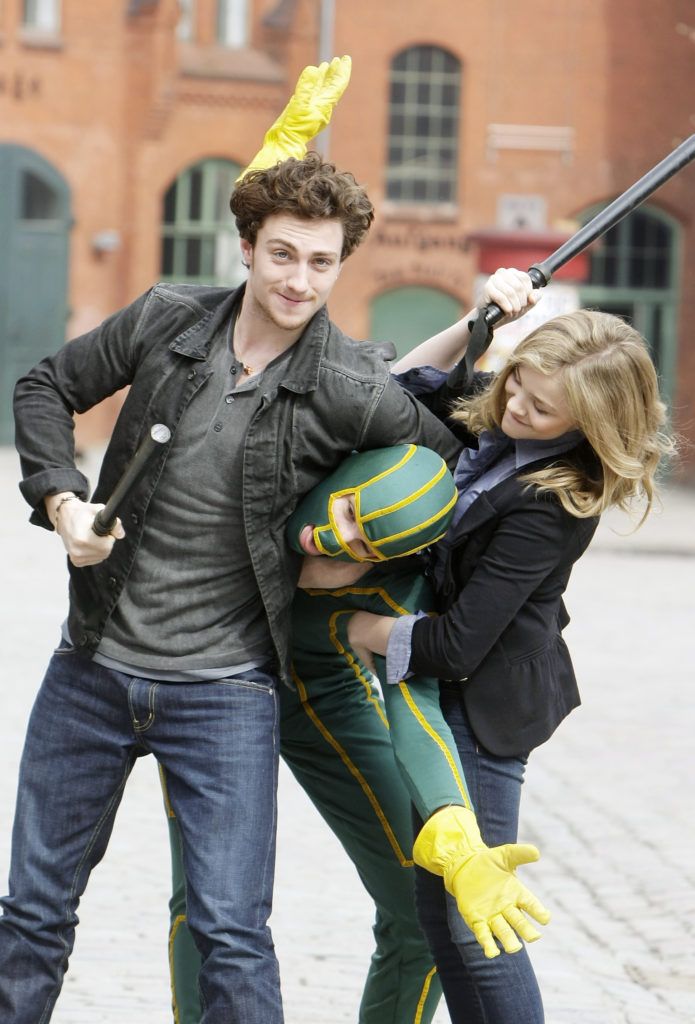 Actor Aaron Johnson, superhero character and actress Chloe Moretz attend the photocall of 'Kick-Ass' at Kulturbrauerei on March 30, 2010 in Berlin, Germany.  (Photo by Florian Seefried/Getty Images)