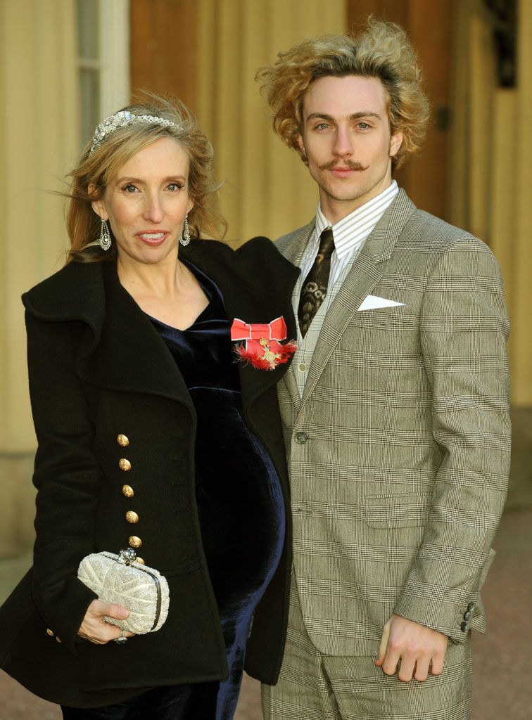 Sam Taylor-Wood wears her OBE with partner Aaron Johnson, after it was presented to her by Prince Charles, Prince of Wales during an Investiture Ceremony at Buckingham Palace on December 14, 2011 in London. (Photo by John Stillwell - WPA Pool/Getty Images)