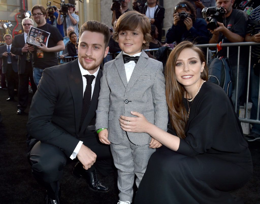 Actors Aaron Taylor-Johnson, Carson Bolde and Elizabeth Olsen attend the premiere of Warner Bros. Pictures and Legendary Pictures' "Godzilla" at Dolby Theatre on May 8, 2014 in Hollywood, California.  (Photo by Kevin Winter/Getty Images)