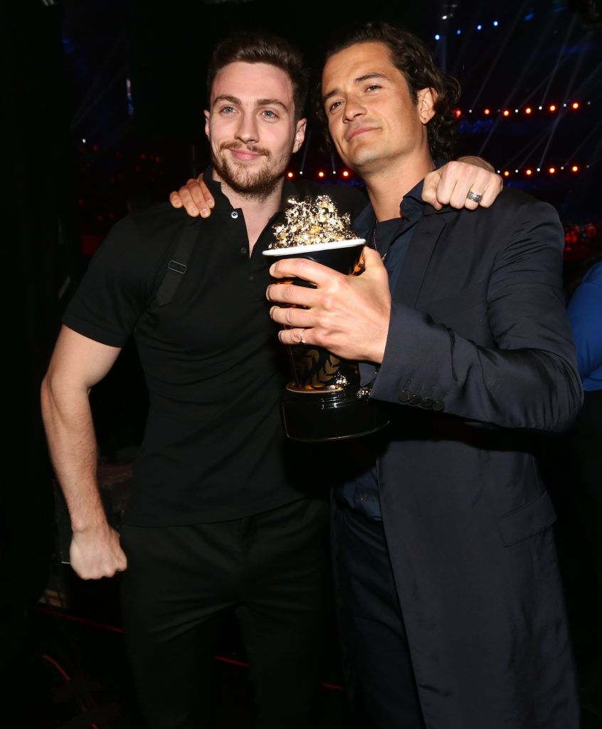 Aaron Johnson and Orlando Bloom attend the 2014 MTV Movie Awards at Nokia Theatre L.A. Live on April 13, 2014 in Los Angeles, California.  (Photo by Christopher Polk/Getty Images)