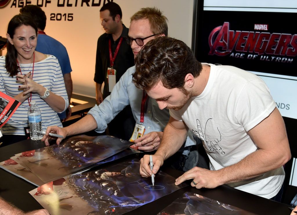 Actors Paul Bettany (L) and Aaron Taylor-Johnson attend Marvel's "Avengers: Age Of Ultron" Hall H Panel Booth Signing during Comic-Con International 2014 at San Diego Convention Center on July 26, 2014 in San Diego, California.  (Photo by Alberto E. Rodriguez/Getty Images for Disney)