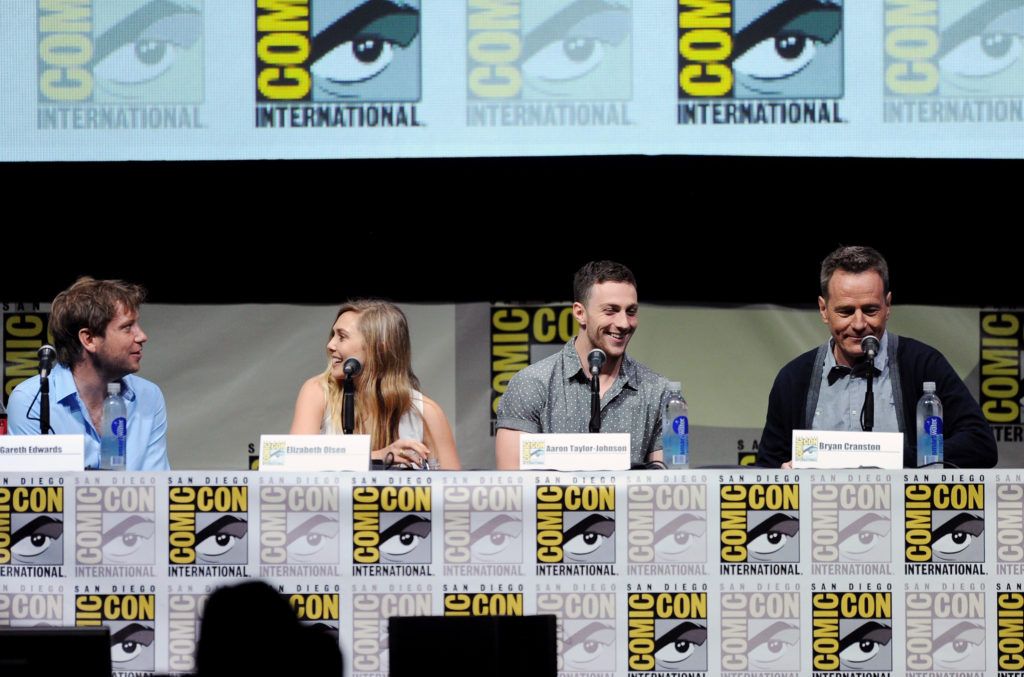Director Gareth Edwards, actress Elizabeth Olsen, actor Aaron Taylor-Johnson and actor Bryan Cranston speak onstage at the Warner Bros. and Legendary Pictures preview of "Godzill" during Comic-Con International 2013 at San Diego Convention Center on July 20, 2013 in San Diego, California.  (Photo by Kevin Winter/Getty Images)