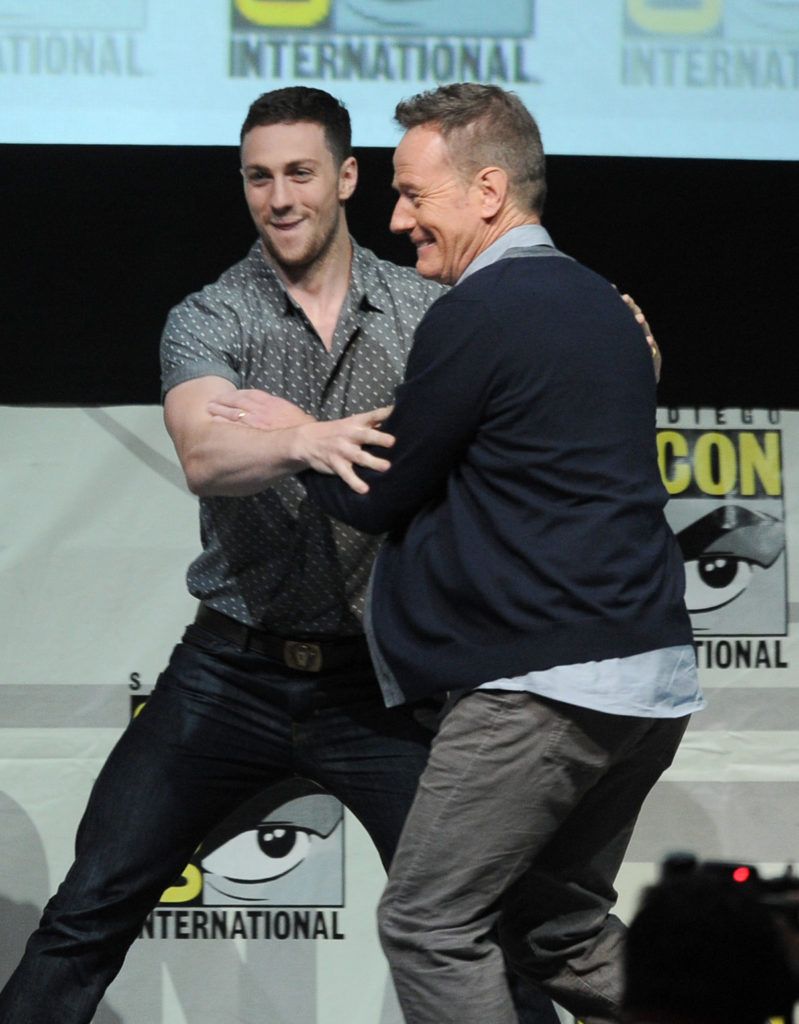 Actor Aaron Taylor-Johnson (L) and actor Bryan Cranston speak onstage at the Warner Bros. and Legendary Pictures preview of "Godzilla" during Comic-Con International 2013 at San Diego Convention Center on July 20, 2013 in San Diego, California.  (Photo by Kevin Winter/Getty Images)