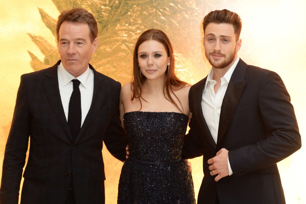 Bryan Cranston, Elizabeth Olsen and Aaron Taylor Johnson attend the European premiere of 'Godzilla' at the Odeon Leicester Square on May 11, 2014 in London, England.  (Photo by Dave J Hogan/Getty Images)