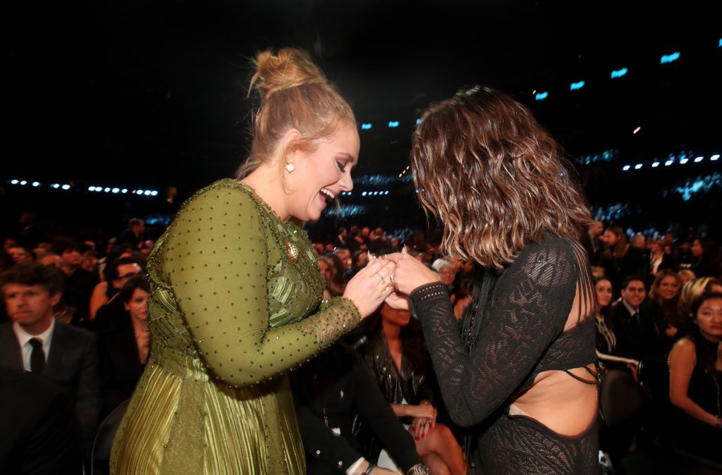 LOS ANGELES, CA - FEBRUARY 12:  Singer Adele (L) and media personality Chrissy Teigen during The 59th GRAMMY Awards at STAPLES Center on February 12, 2017 in Los Angeles, California.  (Photo by Christopher Polk/Getty Images for NARAS)