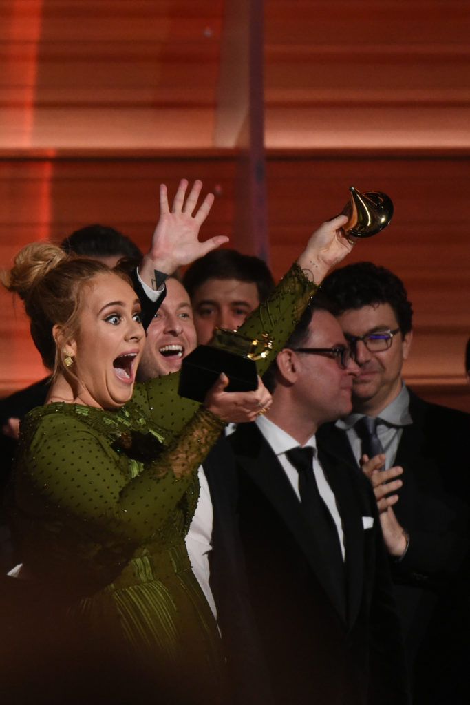 Adele celebrates her Grammys' awards including Best record and Best album of the year  performs onstage during the 59th Annual Grammy music Awards on February 12, 2017, in Los Angeles, California.   (Photo VALERIE MACON/AFP/Getty Images)