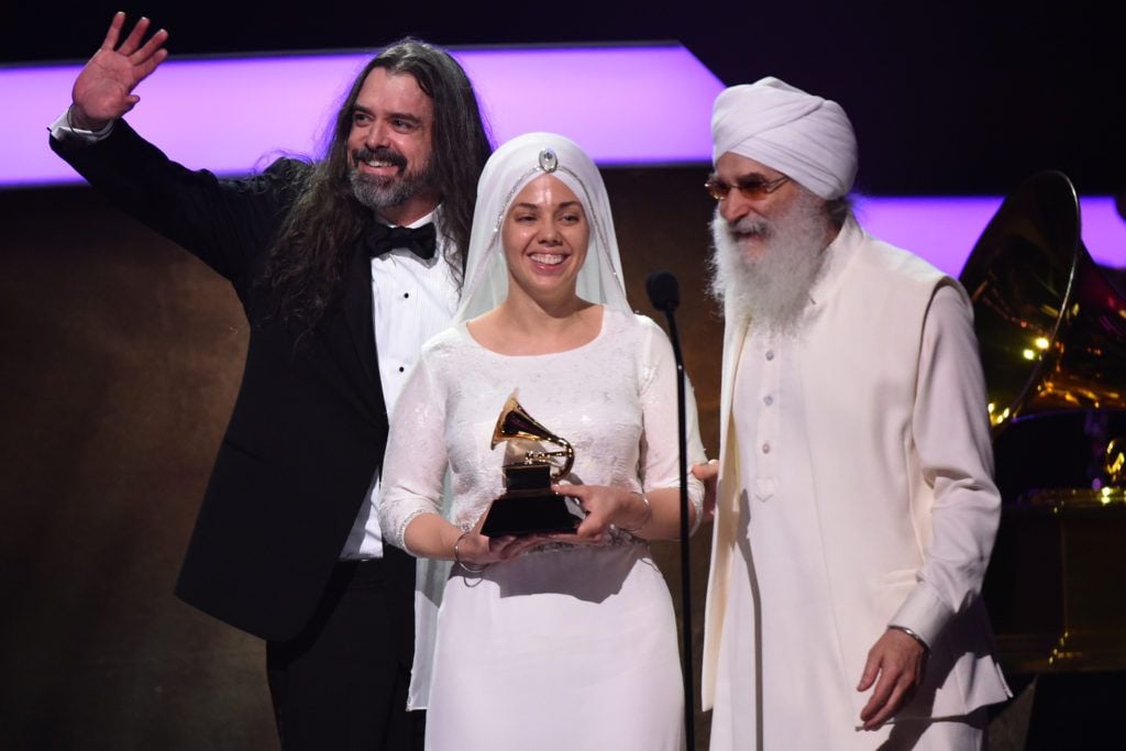 Members of New Age group White Sun acknowledge their Grammy onstage during the 59th Annual Grammy music Awards pre-telecast on February 12, 2017, in Los Angeles, California.  (Photo VALERIE MACON/AFP/Getty Images)
