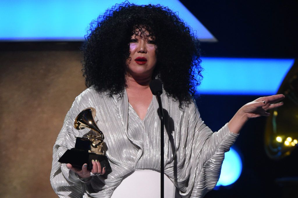 Host Margaret Cho  holds a Grammy award during the 59th Annual Grammy music Awards pre-telecast on February 12, 2017, in Los Angeles, California.   (Photo VALERIE MACON/AFP/Getty Images)