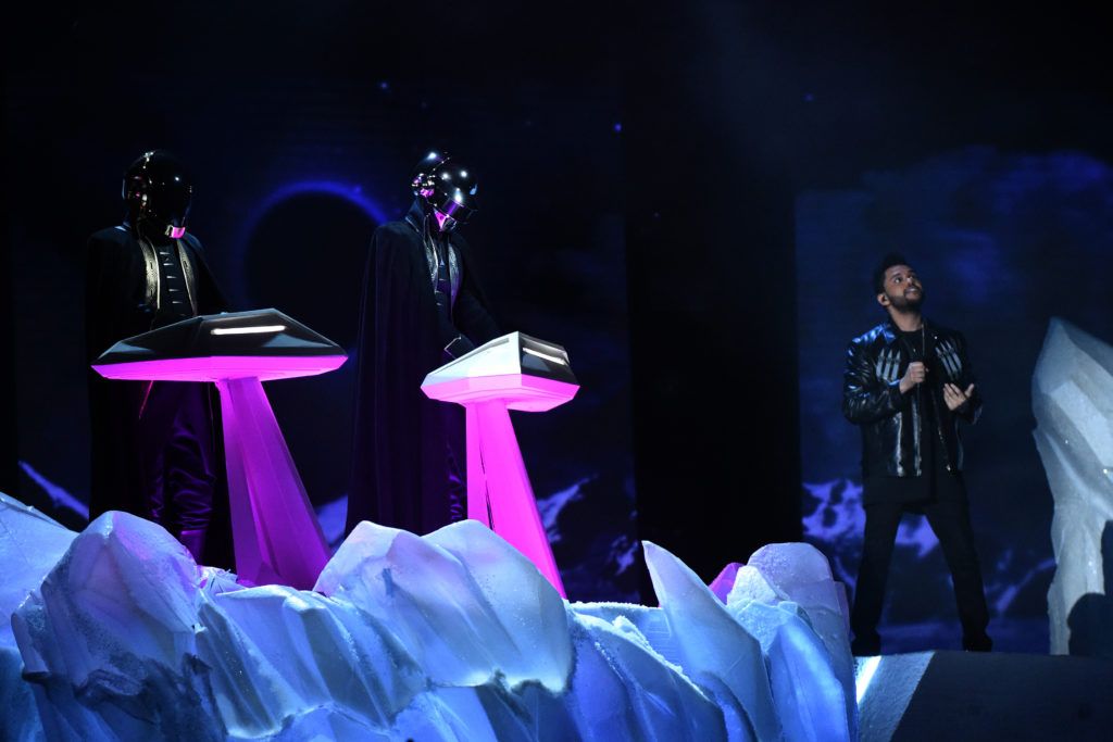 French Electro artists Daft Punk and The Weeknd (R) perform onstage during the 59th Annual Grammy music Awards on February 12, 2017, in Los Angeles, California.  / AFP / VALERIE MACON        (Photo credit should read VALERIE MACON/AFP/Getty Images)