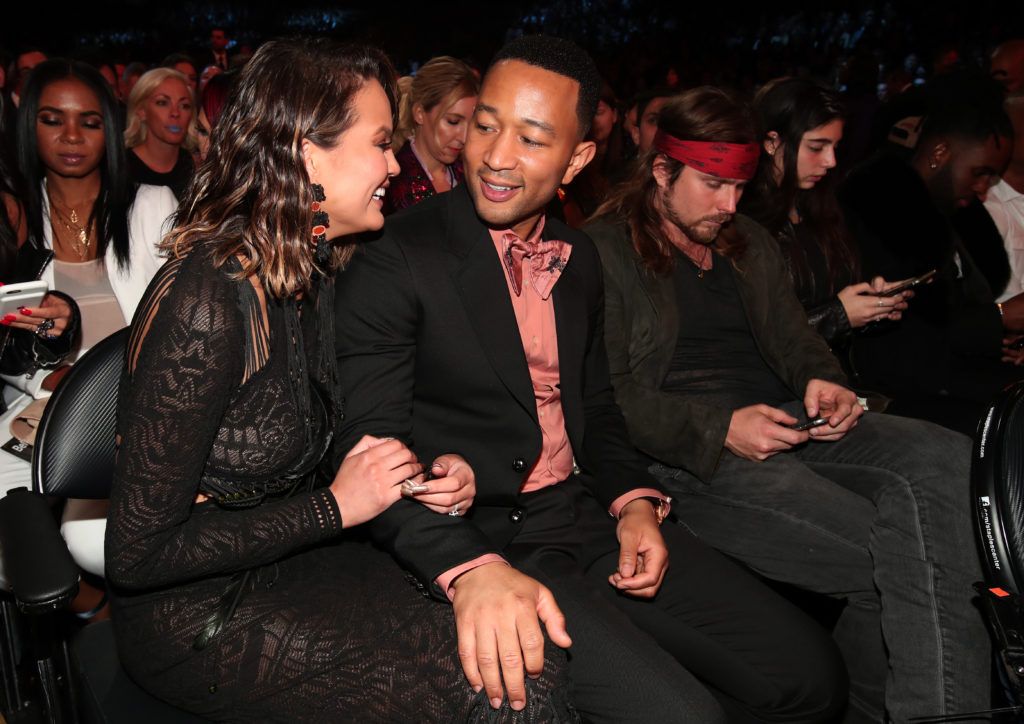 LOS ANGELES, CA - FEBRUARY 12:  Media Personality Chrissy Teigen (L) and musician John Legend during The 59th GRAMMY Awards at STAPLES Center on February 12, 2017 in Los Angeles, California.  (Photo by Christopher Polk/Getty Images for NARAS)