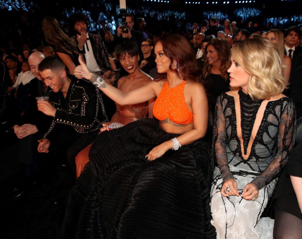 LOS ANGELES, CA - FEBRUARY 12:  (L-R) Singer Nick Jonas, Melissa Forde, and singers Rihanna and Carrie Underwood during The 59th GRAMMY Awards at STAPLES Center on February 12, 2017 in Los Angeles, California.  (Photo by Christopher Polk/Getty Images for NARAS)