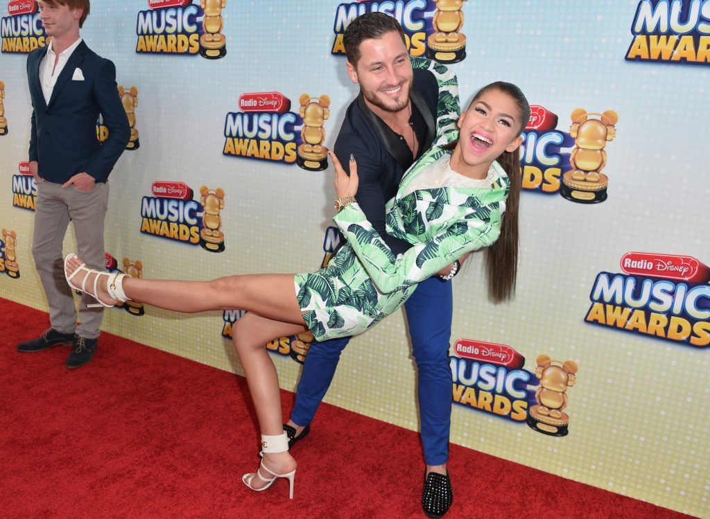 Professional dancer Val Chmerkovskiy and actress Zendaya Coleman arrive to the 2013 Radio Disney Music Awards at Nokia Theatre L.A. Live on April 27, 2013 in Los Angeles, California.  (Photo by Alberto E. Rodriguez/Getty Images)