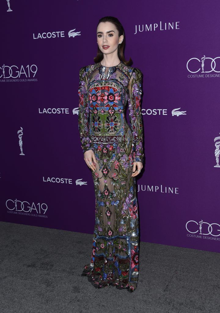 Lily Collins attends the red carpet arrivals at the 19th Costume Designers Guild awards presented by Lacoste at the Beverly Hilton hotel in Beverly Hills, on February 21, 2017.       (Photo CHRIS DELMAS/AFP/Getty Images)