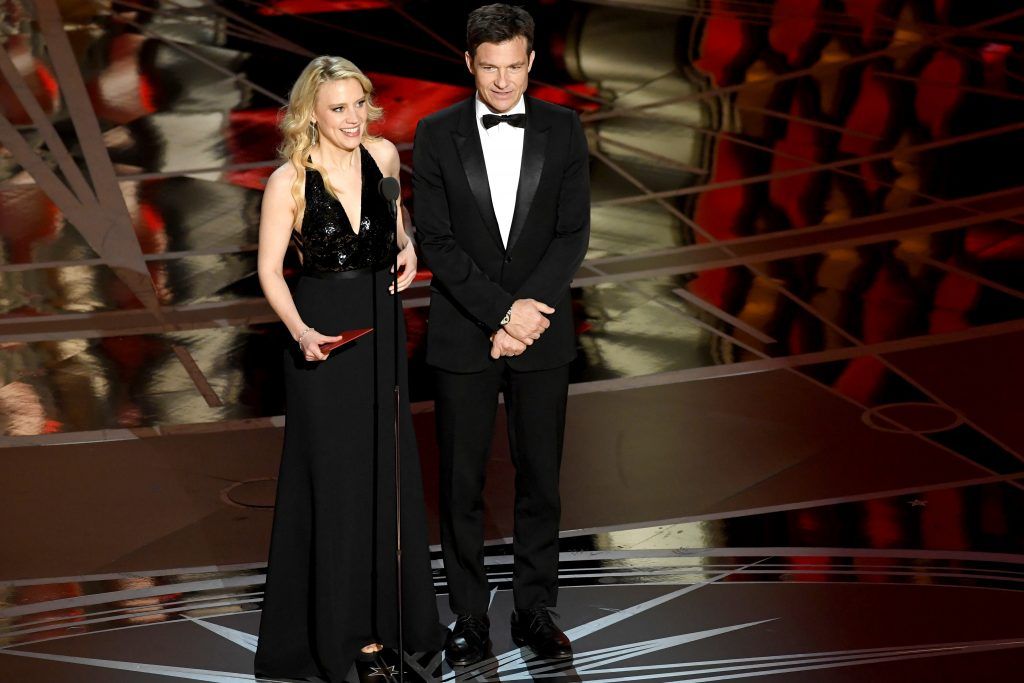 HOLLYWOOD, CA - FEBRUARY 26:  Actors Kate McKinnon (L) and Jason Bateman speak onstage during the 89th Annual Academy Awards at Hollywood & Highland Center on February 26, 2017 in Hollywood, California.  (Photo by Kevin Winter/Getty Images)