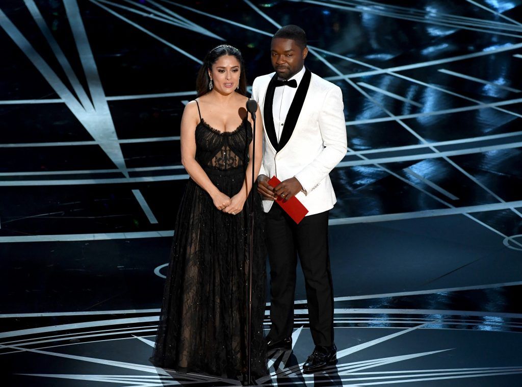 HOLLYWOOD, CA - FEBRUARY 26:  Actors Salma Hayek (L) and David Oyelowo speak onstage during the 89th Annual Academy Awards at Hollywood & Highland Center on February 26, 2017 in Hollywood, California.  (Photo by Kevin Winter/Getty Images)