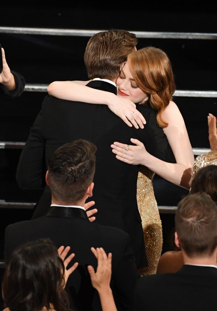 HOLLYWOOD, CA - FEBRUARY 26:  Actors Ryan Gosling (L) and Emma Stone embrace in the audience during the 89th Annual Academy Awards at Hollywood & Highland Center on February 26, 2017 in Hollywood, California.  (Photo by Kevin Winter/Getty Images)