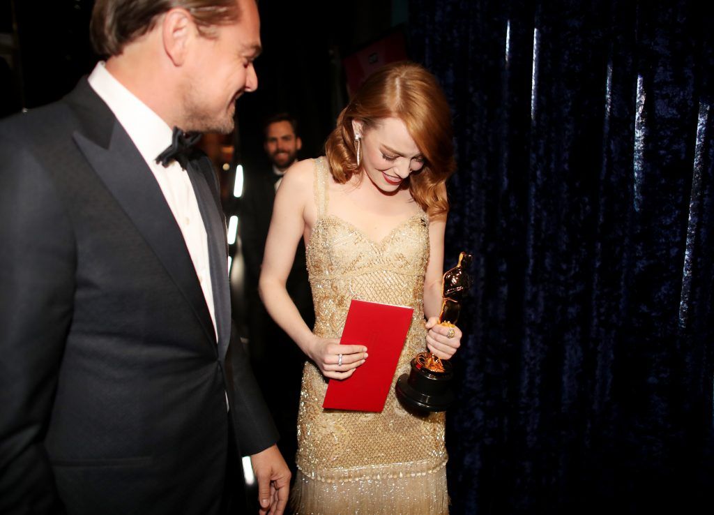 HOLLYWOOD, CA - FEBRUARY 26:  Actor Leonardo DiCaprio (L) and actress Emma Stone, winner of Best Actress for 'La La Land' pose backstage during the 89th Annual Academy Awards at Hollywood & Highland Center on February 26, 2017 in Hollywood, California.  (Photo by Christopher Polk/Getty Images)