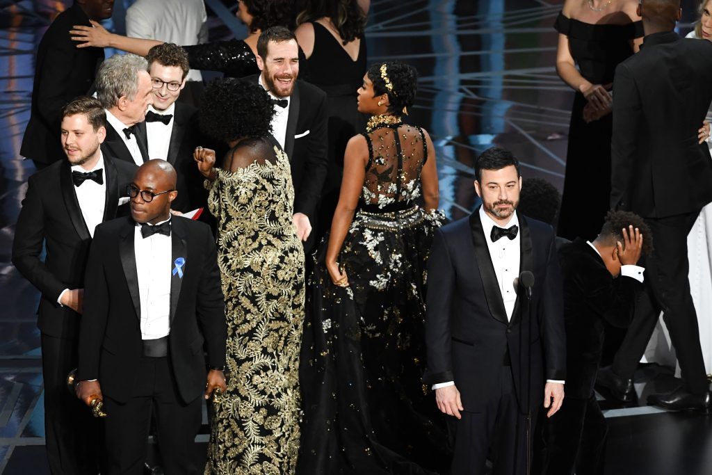 HOLLYWOOD, CA - FEBRUARY 26:  Host Jimmy Kimmel (R) speaks onstage as cast/crew of 'Moonlight' celebrate winning Best Picture during the 89th Annual Academy Awards at Hollywood & Highland Center on February 26, 2017 in Hollywood, California.  (Photo by Kevin Winter/Getty Images)