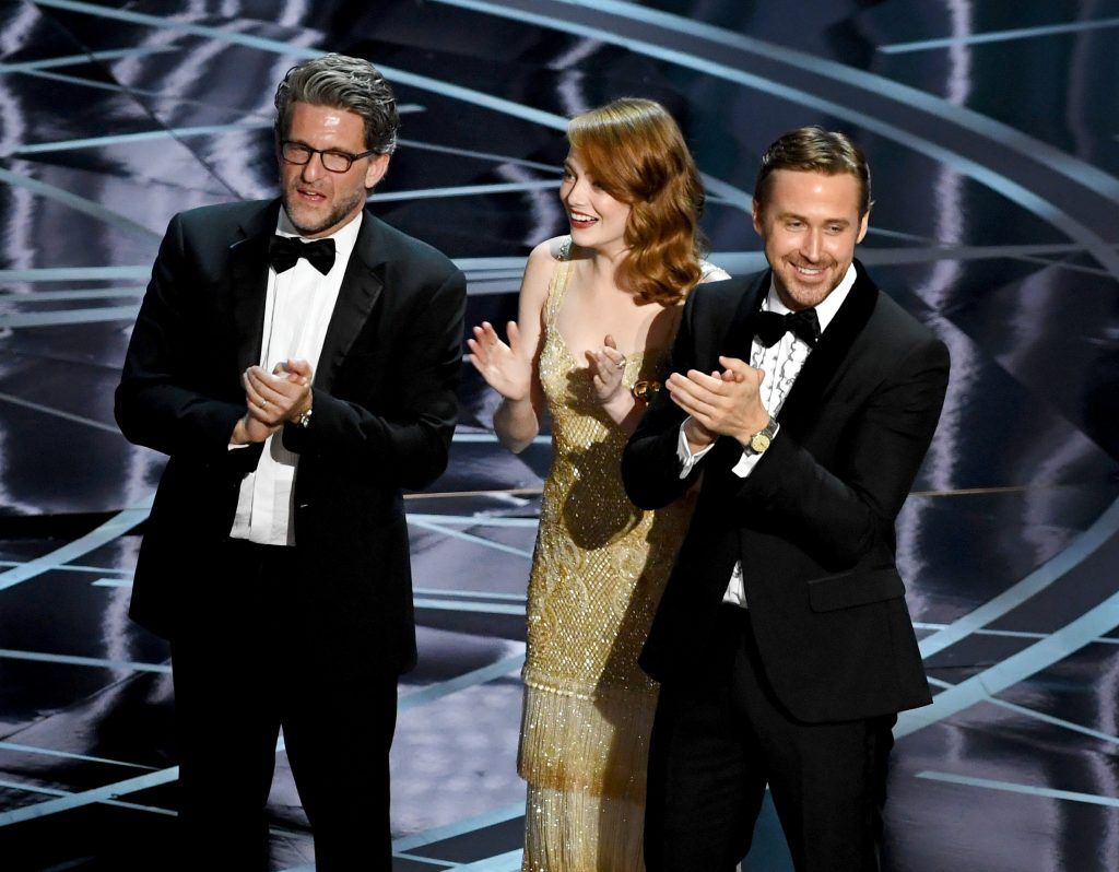 HOLLYWOOD, CA - FEBRUARY 26:  (L-R) Producer Gary Gilbert, actors Emma Stone and Ryan Gosling celebrate 'La La Land' winning Best Picture due to a presentation error (the actual winner was later announced as 'Moonlight') onstage during the 89th Annual Academy Awards at Hollywood & Highland Center on February 26, 2017 in Hollywood, California.  (Photo by Kevin Winter/Getty Images)