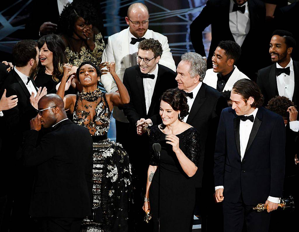 HOLLYWOOD, CA - FEBRUARY 26:  Producer Adele Romanski (C), writer/director Barry Jenkins, producer Jeremy Kleiner and cast/crew members accept Best Picture for 'Moonlight' onstage during the 89th Annual Academy Awards at Hollywood & Highland Center on February 26, 2017 in Hollywood, California.  (Photo by Kevin Winter/Getty Images)