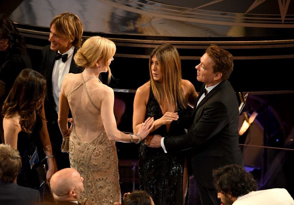 HOLLYWOOD, CA - FEBRUARY 26:  (L-R) Musician Keith Urban, actors Nicole Kidman and Jennifer Aniston speak in the audience during the 89th Annual Academy Awards at Hollywood & Highland Center on February 26, 2017 in Hollywood, California.  (Photo by Kevin Winter/Getty Images)