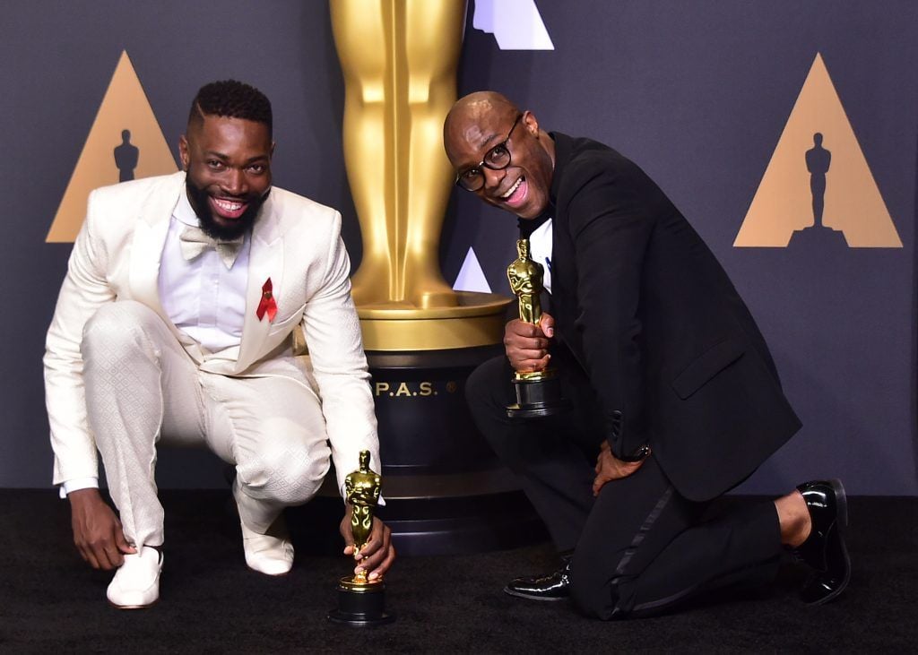 Writer/director Barry Jenkins (L) and writer Tarell Alvin McCraney pose in the press room with the Best Adapted Screenplay award for 'Moonlight' during the 89th Oscars on February 26, 2017 in Hollywood, California. (Photo FREDERIC J. BROWN/AFP/Getty Images)