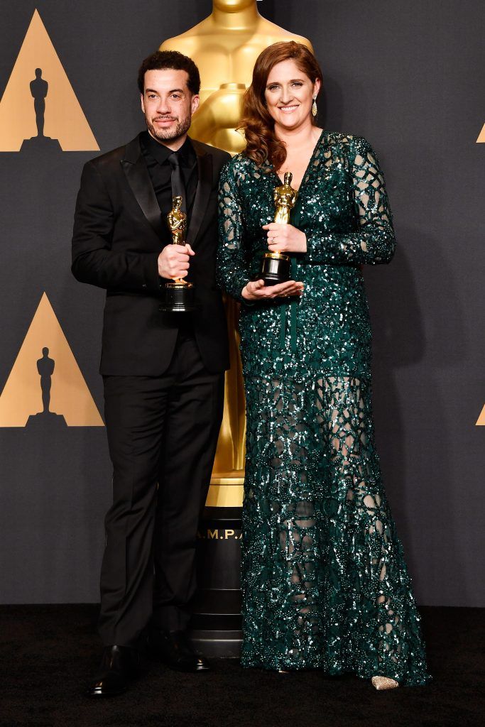 HOLLYWOOD, CA - FEBRUARY 26:  Director Ezra Edelman (L) and producer Caroline Waterlow, winners of Best Documentary Feature for 'O.J.: Made in America' pose in the press room during the 89th Annual Academy Awards at Hollywood & Highland Center on February 26, 2017 in Hollywood, California.  (Photo by Frazer Harrison/Getty Images)