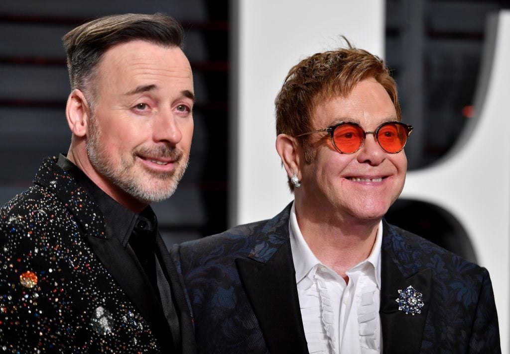 BEVERLY HILLS, CA - FEBRUARY 26:  Director-producer David Furnish (L) and recording artist Elton John attend the 2017 Vanity Fair Oscar Party hosted by Graydon Carter at Wallis Annenberg Center for the Performing Arts on February 26, 2017 in Beverly Hills, California.  (Photo by Pascal Le Segretain/Getty Images)