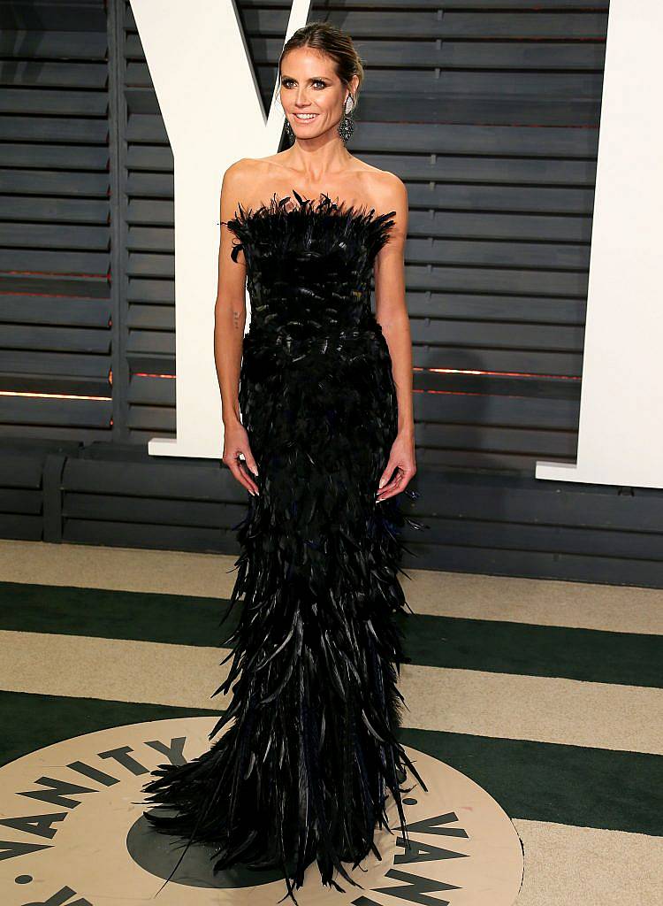 German-American model Heidi Klum poses as she arrives to the Vanity Fair Party following the 88th Academy Awards at The Wallis Annenberg Center for the Performing Arts in Beverly Hills, California, on February 26, 2017. (Photo JEAN-BAPTISTE LACROIX/AFP/Getty Images)