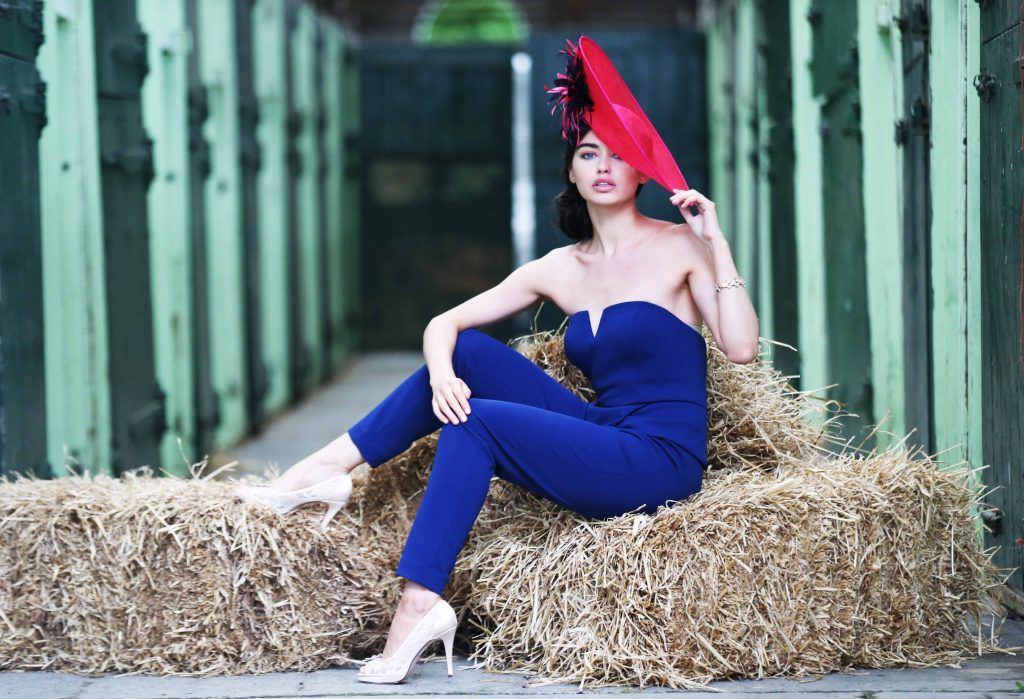 NO REPRO FEE Horse Show Ladies Day. Pictured, model Sarah wears ‘House of Fraser’ pink ‘Linea’ Saucer: €130, ‘Adrianna Papell’ strapless jumpsuit from ‘House of Fraser’: €235, ‘Linea' lace peep toe heel from ‘House of Fraser’: €85, ‘Oasis’ bracelet €14. Top Irish Stylist, Courtney Smith, is announced as a judge today for the Dundrum Town Centre Ladies Day at the Dublin Horse Show in the RDS 10th August. For more information visit dublinhorseshow.com/ladies-day. Photograph: Leon Farrell / Photocall.
